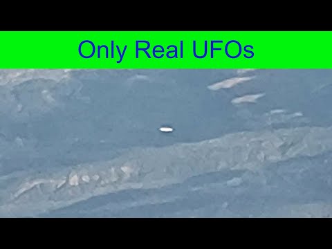 UFO | Flying Saucer filmed from the aircraft over US.