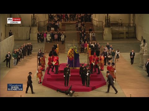Queen’s guard collapses in front of her coffin