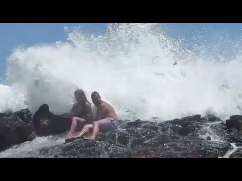 Perfect Honeymoon Snap Ruined By Massive Wave